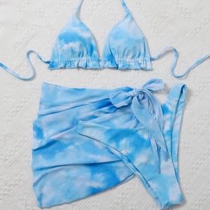 Three piece blue tie dye bathing suit.